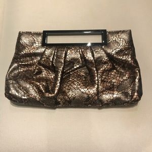 Snakeskin bronze pattern clutch with metal handle